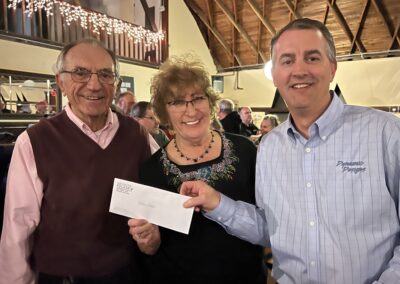 Mike Maroszek and Diane Smith accepting their $500 check from Bruce.